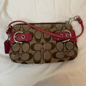 Coach pink and brown wristlet. Some minor wear.
